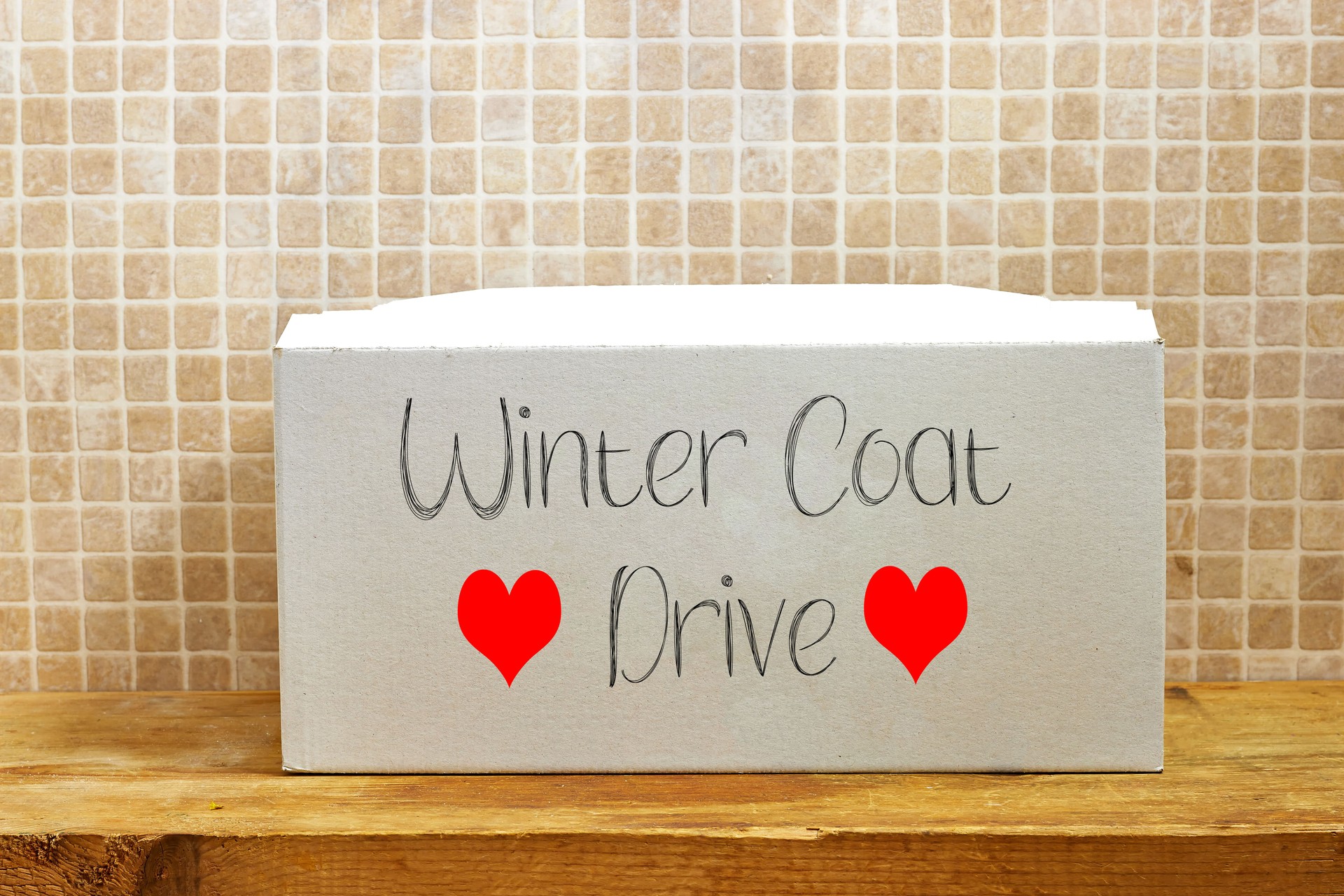Winter Coat Donation Box Decorated with Hearts for a Clothing Drive Event